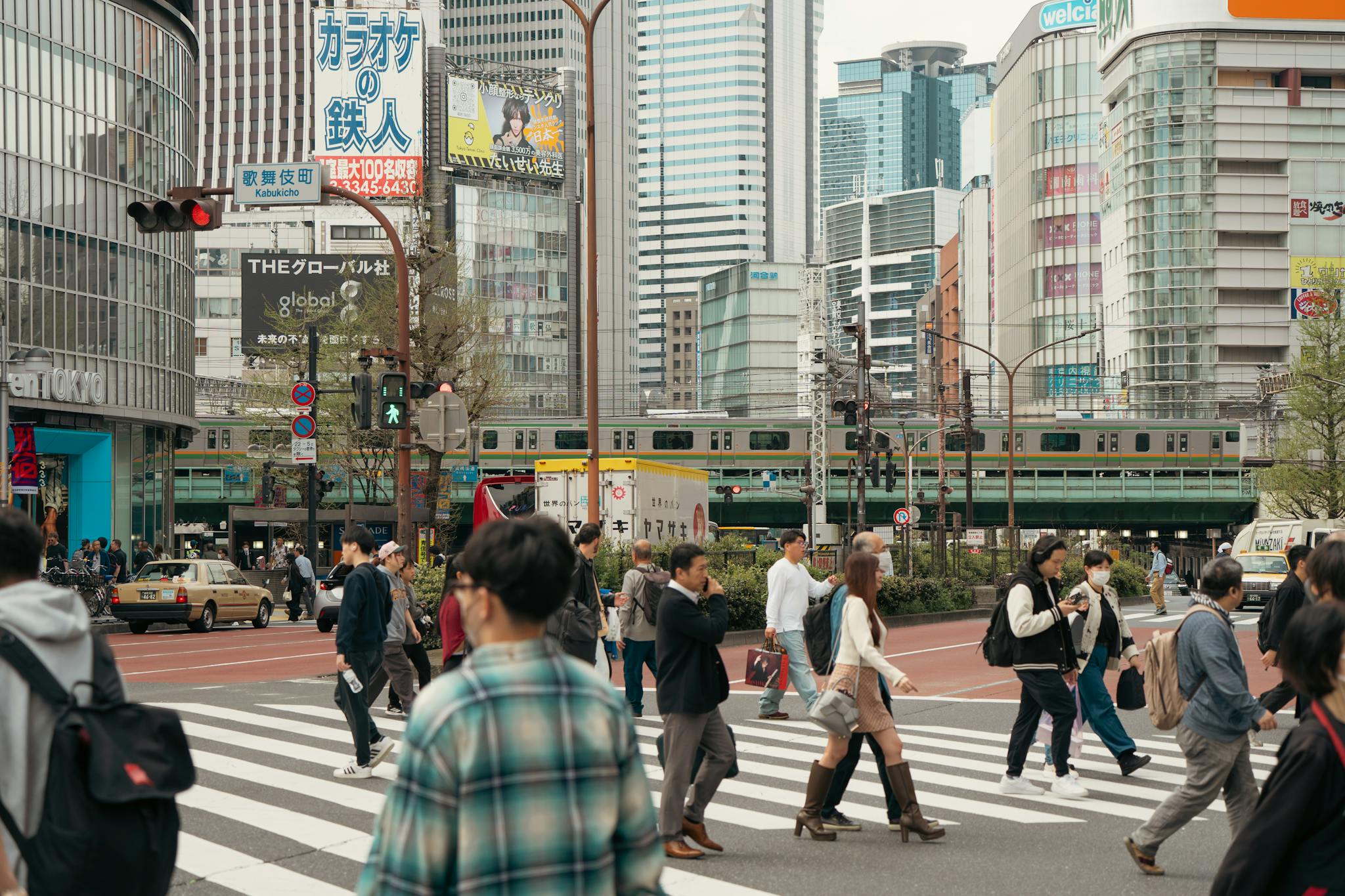 People crossing at Shibuya, Tokyo showcasing urban life and vibrant cityscape.