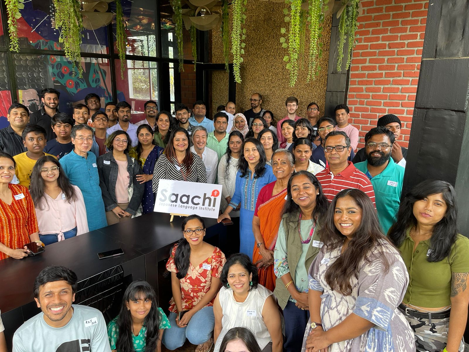 Saachi students gathered at a community event